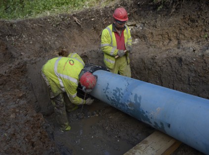 The new section of pipeline being fitted